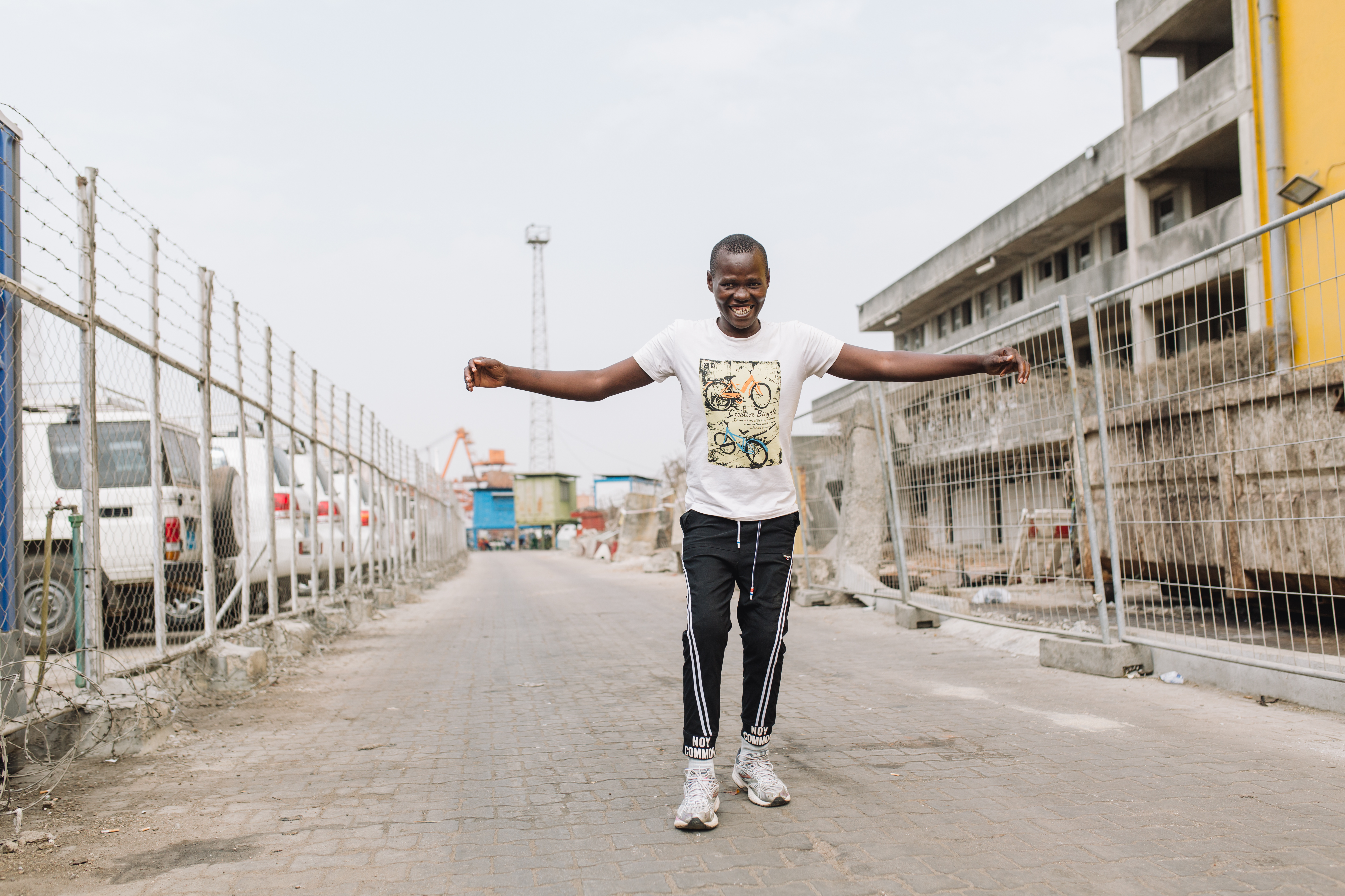 Ibrahima, plastics patient, walking after having surgery to straighten his legs from burn contractures.